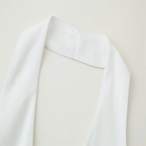 Detail showing high-quality white twill fabric texture and clean stitching of neck strap