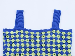 Detail of blue and green checkered knit camisole showing shoulder straps and neckline