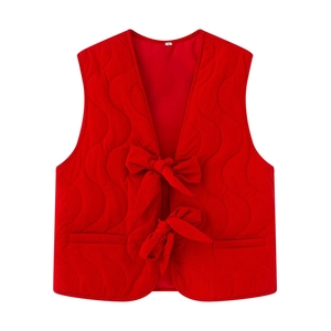 Women red quilted sleeveless vest with wavy stitching and front bow ties on white background