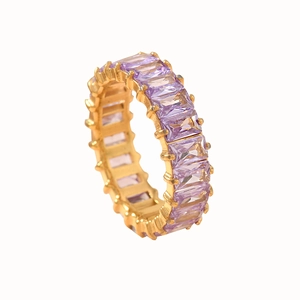 Eternity ring in gold finish featuring emerald-cut lavender cubic zirconia stones