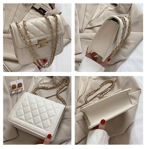 Detail view of white quilted chain bag with gold lock and textured leather finish