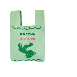 Light green knitted tote bag with cactus and flower pattern and shoulder straps