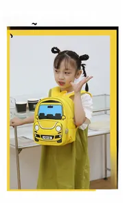 Detail of yellow car-shaped toddler backpack with mesh pocket and waterproof fabric