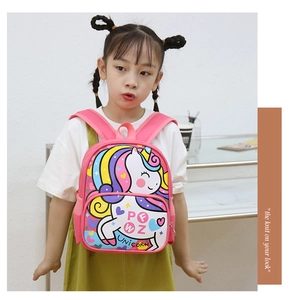 Pink unicorn backpack with wide padded straps for toddlers shown on a young model