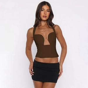 Detail of cut-out halter crop top in brown and black mini skirt for a sexy party look
