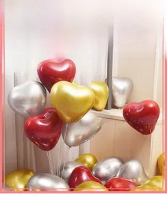 Detail of 10-inch double-layer heart balloons in red, gold, and silver for parties
