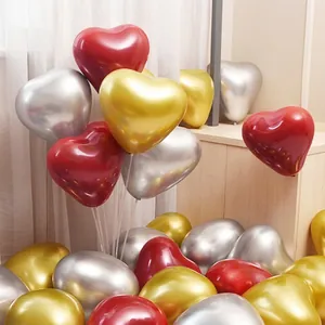 Metallic heart balloons in ruby red, gold, and silver for wedding or party decor
