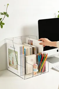 Three-slot transparent acrylic desk organizer showing stable storage for books and magazines