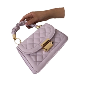 Quilted lavender small square bag with chain strap and gold twist lock closure