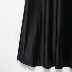Elegant black silk satin halter dress with a glossy finish and fluid drape for women
