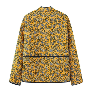 Back view of women's yellow quilted jacket with floral patterns and diamond stitching