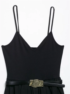 Detail of knit midi dress featuring slim straps and belt with a gold metallic buckle