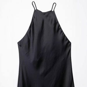 Elegant black silk satin halter neck dress with thin straps for a minimalist look