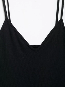 Detail of black ribbed knit camisole featuring double thin shoulder straps and V-neckline