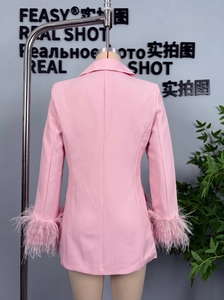 Rear view of pink blazer jacket featuring luxury feather trim on sleeves and slim fit cut