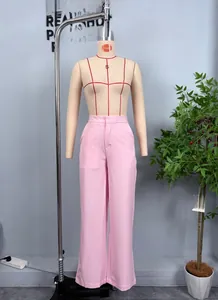 Detail of pink high-waisted wide-leg trousers with side pockets on a mannequin
