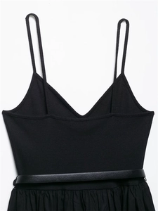 Detail of black ribbed knit midi dress with thin straps and a matching waist belt