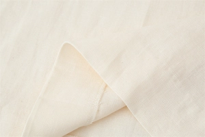 Detailed macro view showing the natural linen-like weave and clean overlock stitching edges