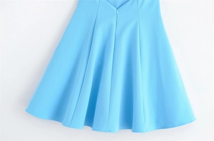 Detail of sky blue A-line skirt featuring hidden zipper and smooth woven fabric texture