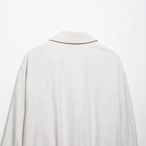 Minimalist beige bomber jacket for women featuring a stylish lapel and drop shoulders