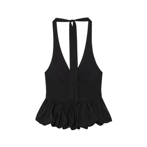 Detail of black halter top featuring deep V-neck, open back, and peplum ruffled hemline