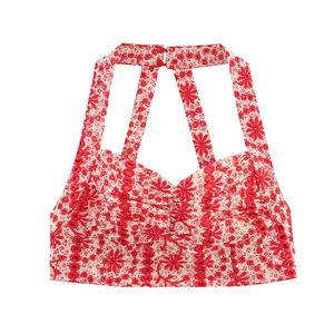 Bohemian white halter top with red floral embroidery and delicate geometric cutouts