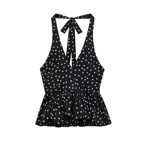 Women's black polka dot halter top with deep V-neck and peplum hem for summer