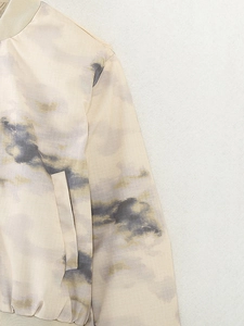 Detail of marble print bomber jacket with ribbed collar and ripstop texture fabric