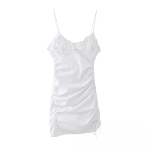 White minimalist mini slip dress with V-neckline, drawstring bow, and ruched side details