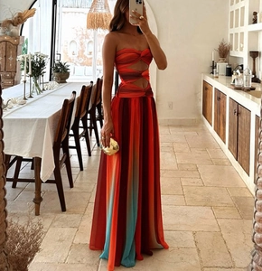 Detail of colorful gradient strapless maxi dress with side waist cut-outs for vacation