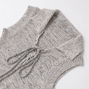 Women's sleeveless grey knit dress with bow tie collar and polo neck design