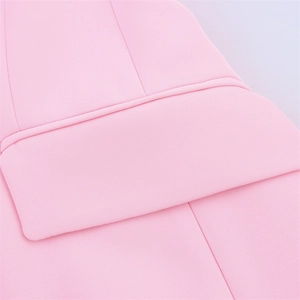 Close-up of pink fabric texture and high-quality seam stitching for women suit