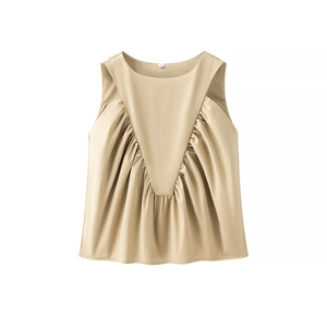 Detail of khaki sleeveless top showing V-shaped pleats and elegant flared umbrella hem