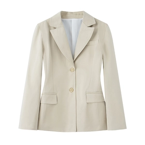 Detail of slim-fit knit blazer featuring a classic notched lapel and flap pockets