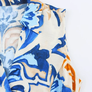 Close-up of bohemian floral print V-neckline and collar on sleeveless summer dress