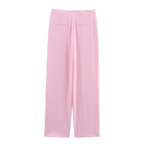 Detail view of pink wide-leg suit pants featuring elegant back pleats and welt pockets