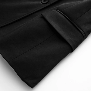 Detailed view of flap pocket and premium twill fabric on black slim knit blazer jacket
