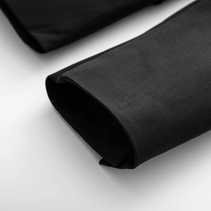 Detail of premium black double-breasted blazer showing twill fabric texture and stitching