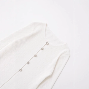 White ribbed knit long sleeve cardigan with silver ring buttons and classic round neck