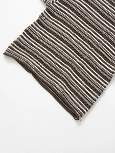 Close-up of the hollow crochet texture on this brown and white striped knit top