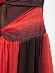 Detailed macro view of mesh layered fabric and back hidden zipper on summer print dress