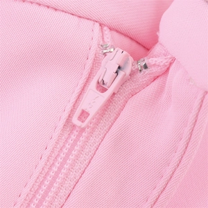 Detailed macro view of high-quality YKK pink zipper on early spring feather suit jacket
