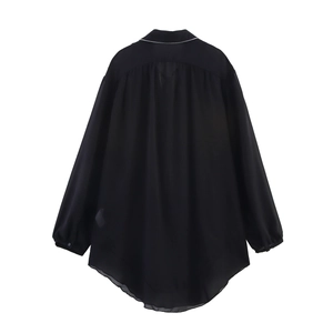Women's black long sleeve shirt with white contrast piping and loose lantern sleeves back view