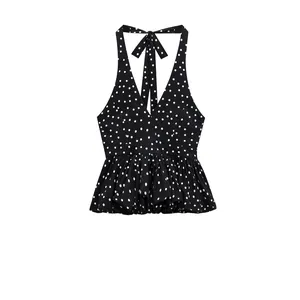 Polka dot halter neck backless top with ruffled hem in black and white style