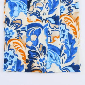 Detail of floral paisley pattern print and metal button on sleeveless summer dress