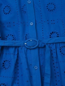 Detail of royal blue dress showing hollow embroidery, button placket, and matching belt