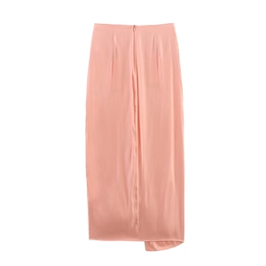 Detail of peach pink satin midi skirt with smooth texture and concealed back zipper