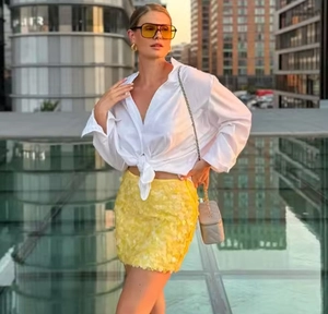 Chic urban street style with white tie-front shirt and yellow sequin mini skirt detail
