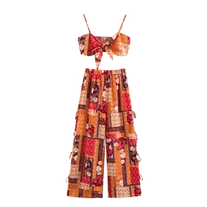 Detail of bohemian floral print two-piece set featuring tie-front top and wide-leg pants