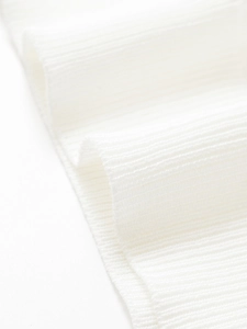 Detailed macro view of pure white rib-knit fabric texture with soft flexible material